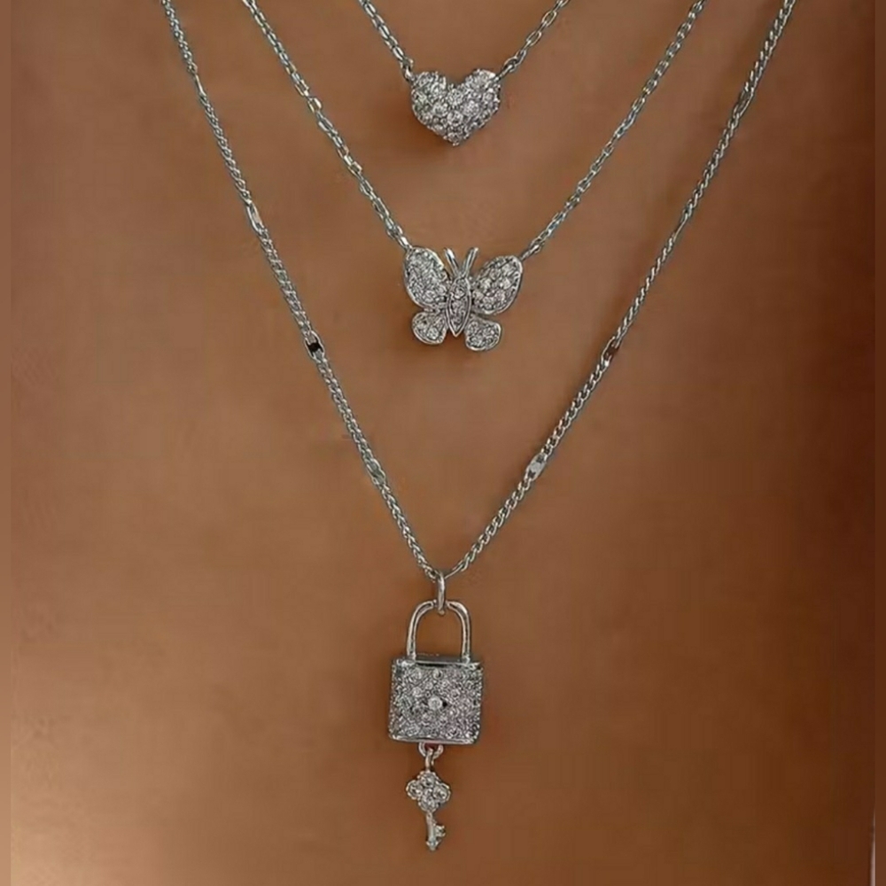 Elegant Silver Necklace Set with Heart, Butterfly, and Lock Charms